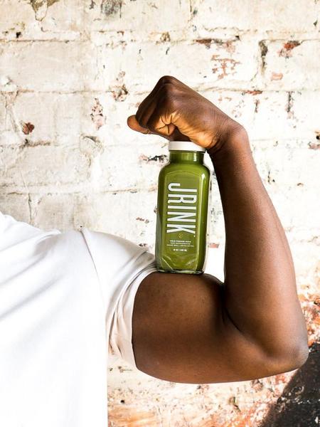 cold pressed juice with strong arm